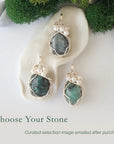 Three silver wire wrapped emerald and freshwater pearl pendants showing natural stone variation, artisan jewelry for women