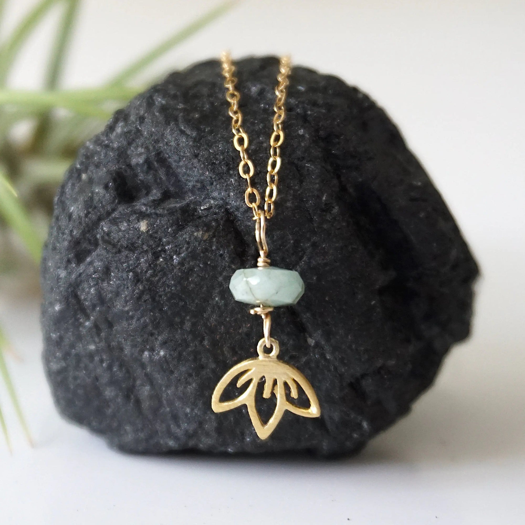 Emerald and lotus necklace for women with natural faceted emerald bead and gold vermeil lotus charm, detailed front view