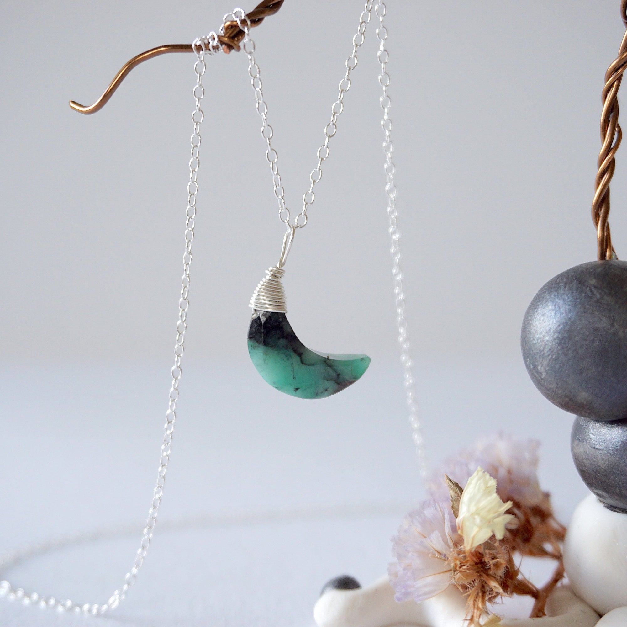 Emerald moon necklace for women with natural faceted emerald crescent pendant in 925 sterling silver, detailed front view