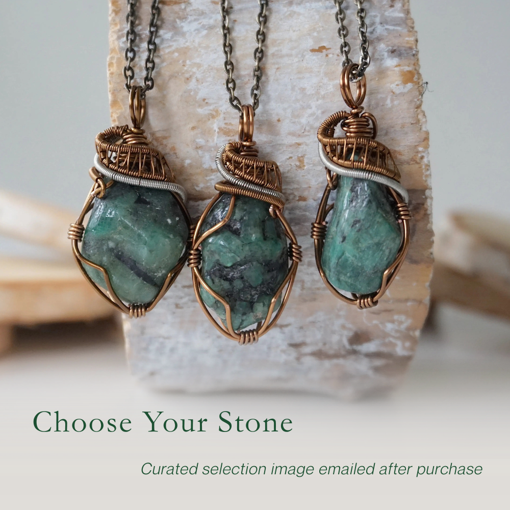 Three raw emerald pendants – showcasing natural variation in size, shape, and green shade, handcrafted unisex birthstone jewelry.