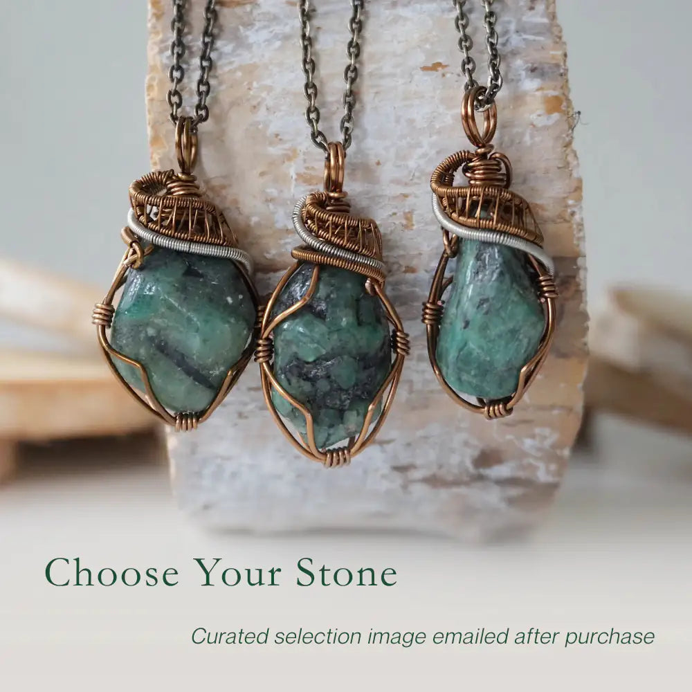 Three raw emerald pendants – showcasing natural variation in size, shape, and green shade, handcrafted unisex birthstone jewelry.