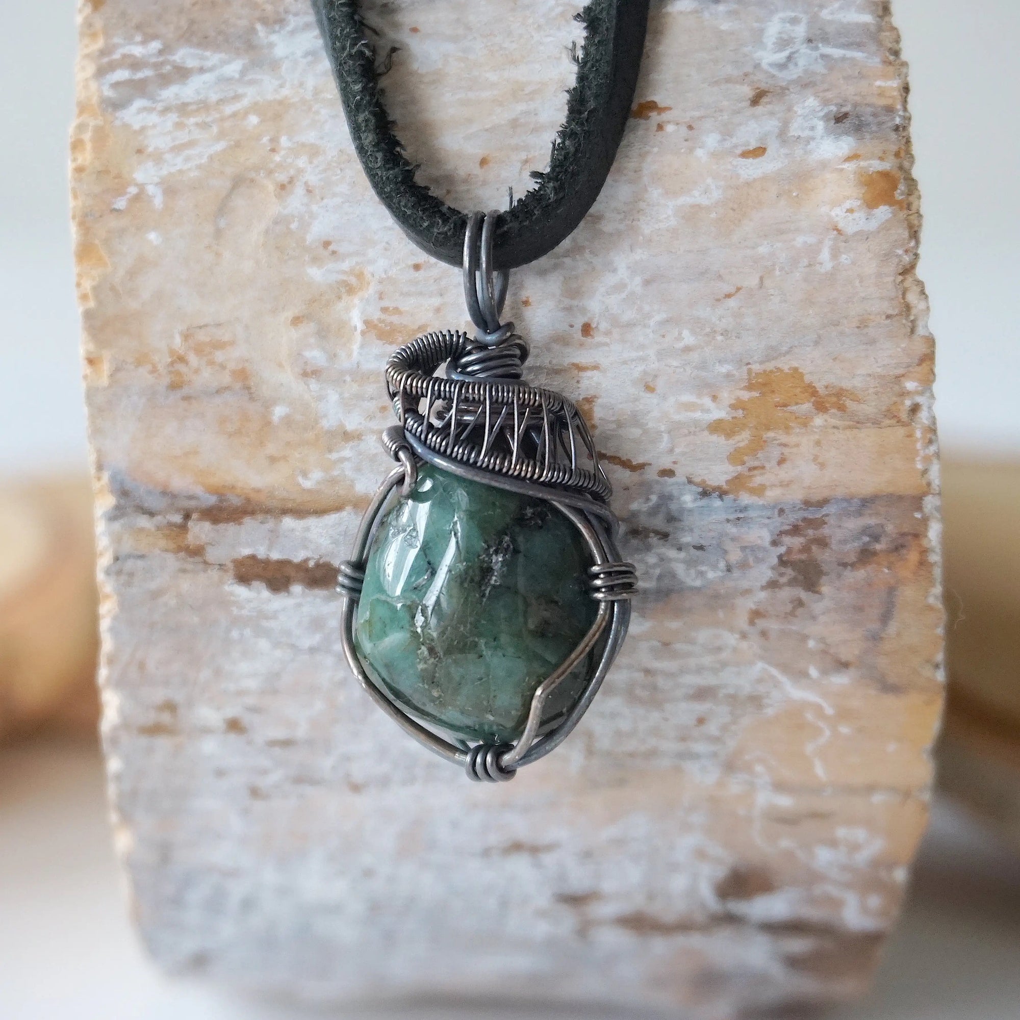 Emerald necklace for men with natural polished-raw emerald in antiqued sterling silver wire wrapping, detailed front view