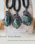 Three emerald pendants for men showing natural variation in emerald size, shape, and green colour in antiqued sterling silver wrapping