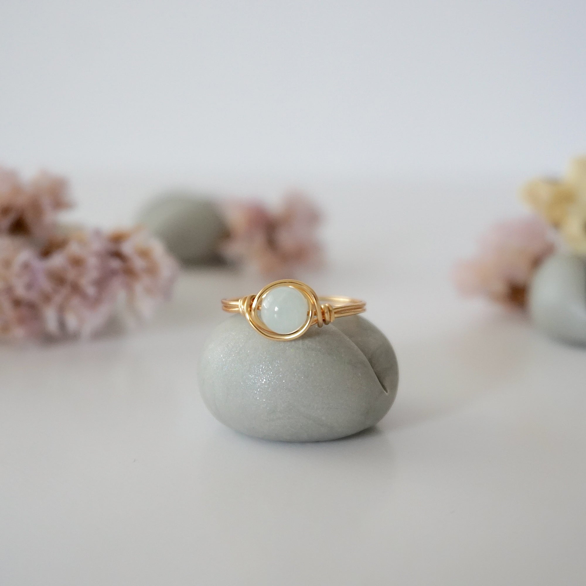 Detailed front view of minimalist gold aquamarine ring, natural 6mm aquamarine bead