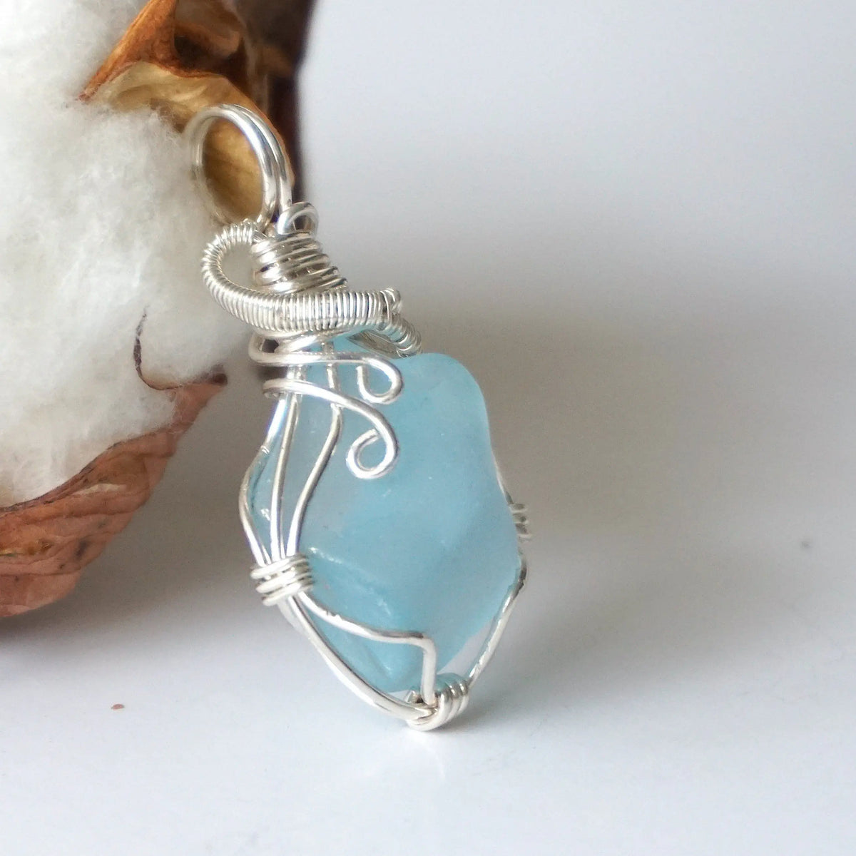 Handmade blue topaz gemstone pendant in sterling silver wire