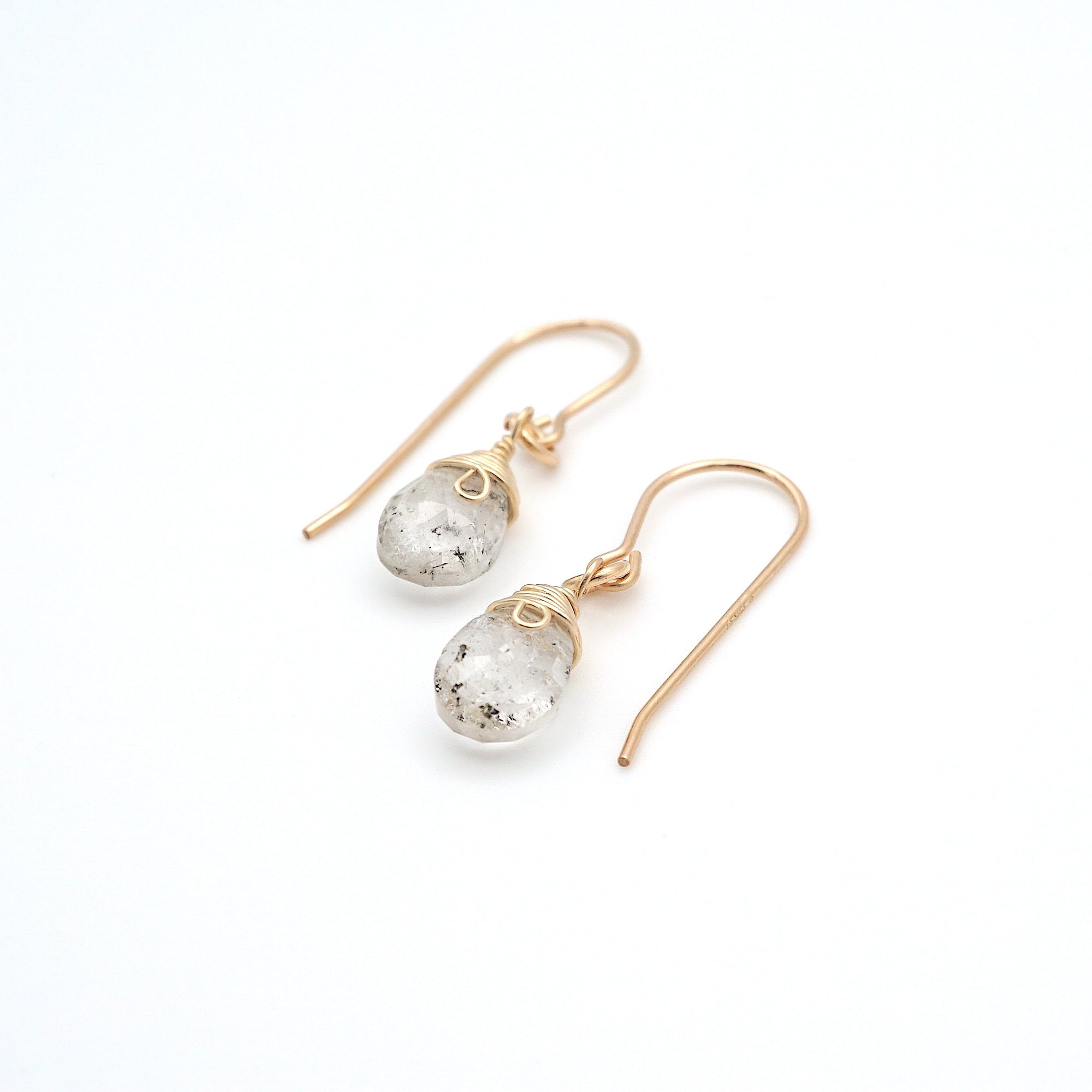 Angled look at herkimer diamond drop earrings, artisan wire wrapping in 14k gold filled, April birthstone
