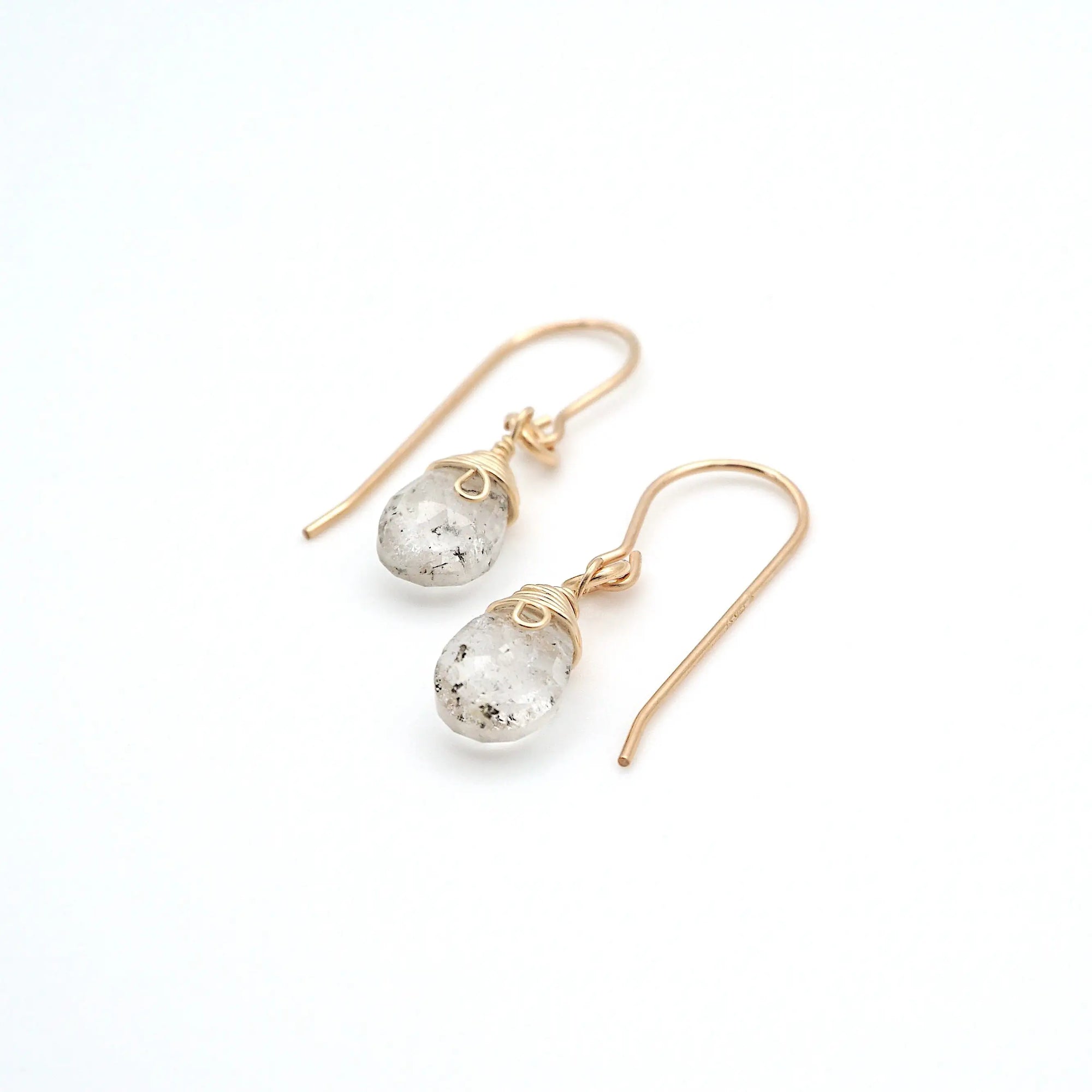 Angled look at herkimer diamond drop earrings, artisan wire wrapping in 14k gold filled, April birthstone