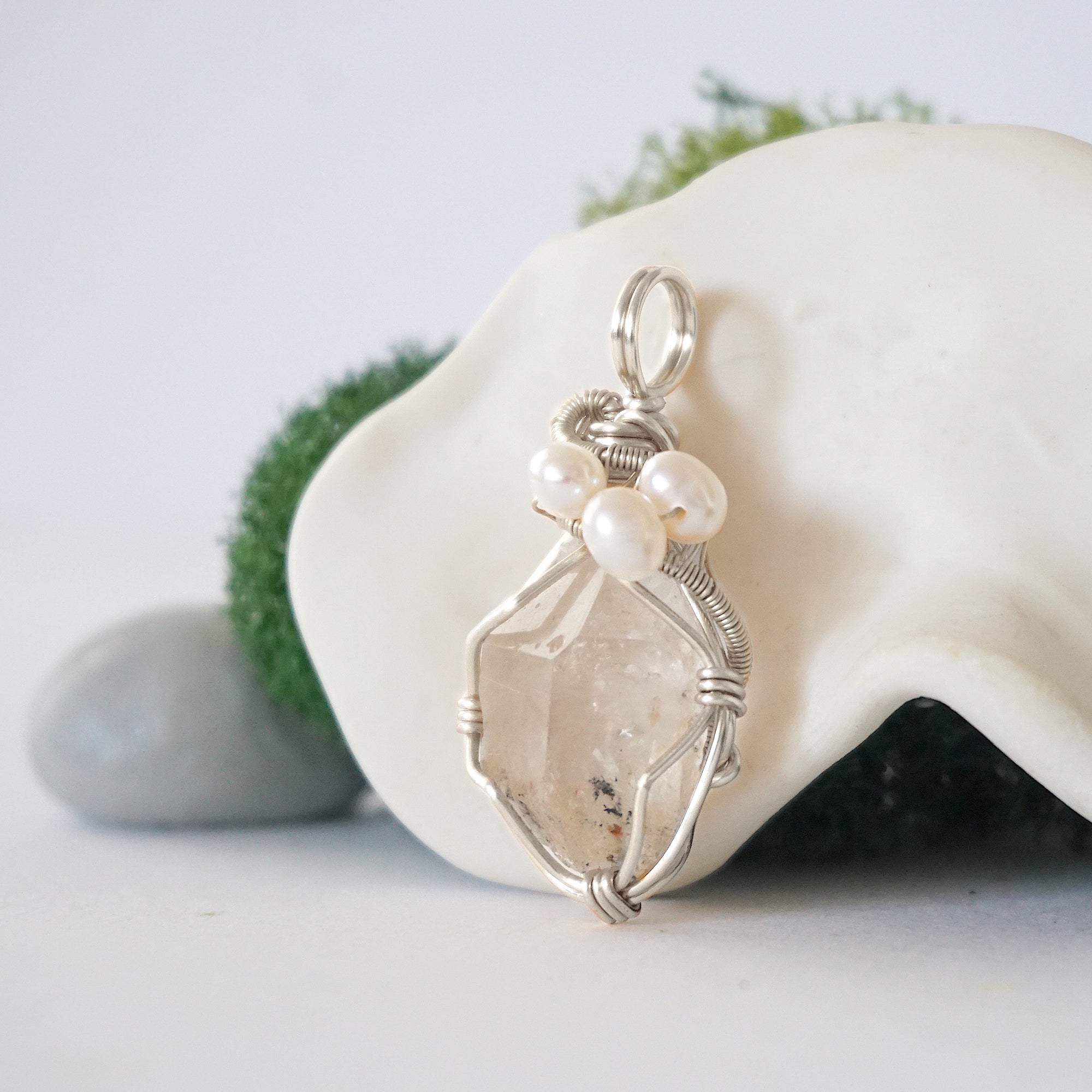 Side angle of handmade herkimer diamond and freshwater pearl pendant necklace, silver wire wrapped jewelry