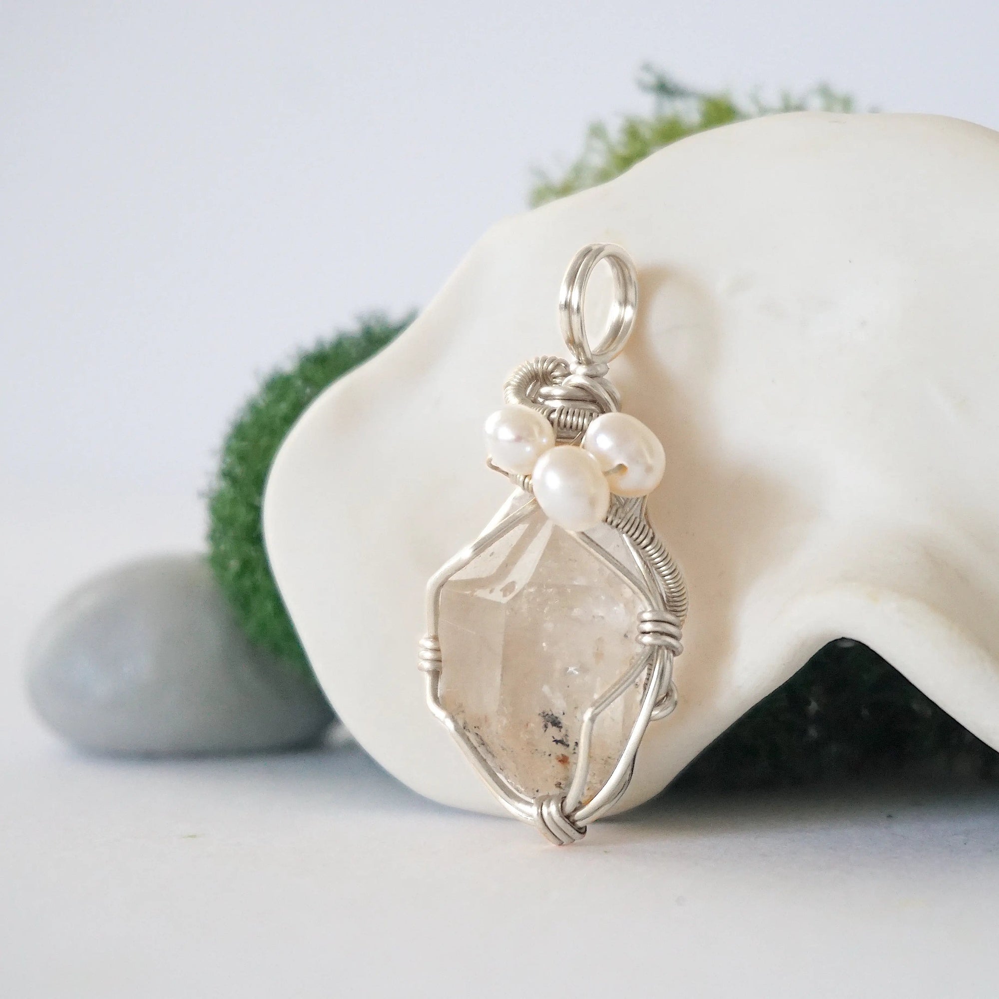 Side angle of handmade herkimer diamond and freshwater pearl pendant necklace, silver wire wrapped jewelry