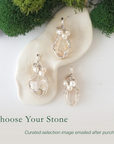 Three silver wire wrapped herkimer diamond and freshwater pearl pendants showing natural stone variation, artisan jewelry for women