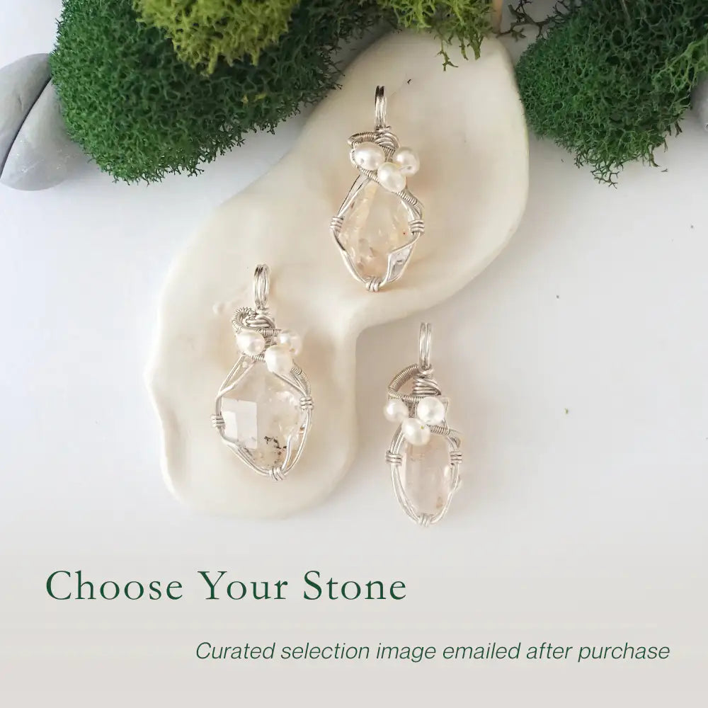 Three silver wire wrapped herkimer diamond and freshwater pearl pendants showing natural stone variation, artisan jewelry for women