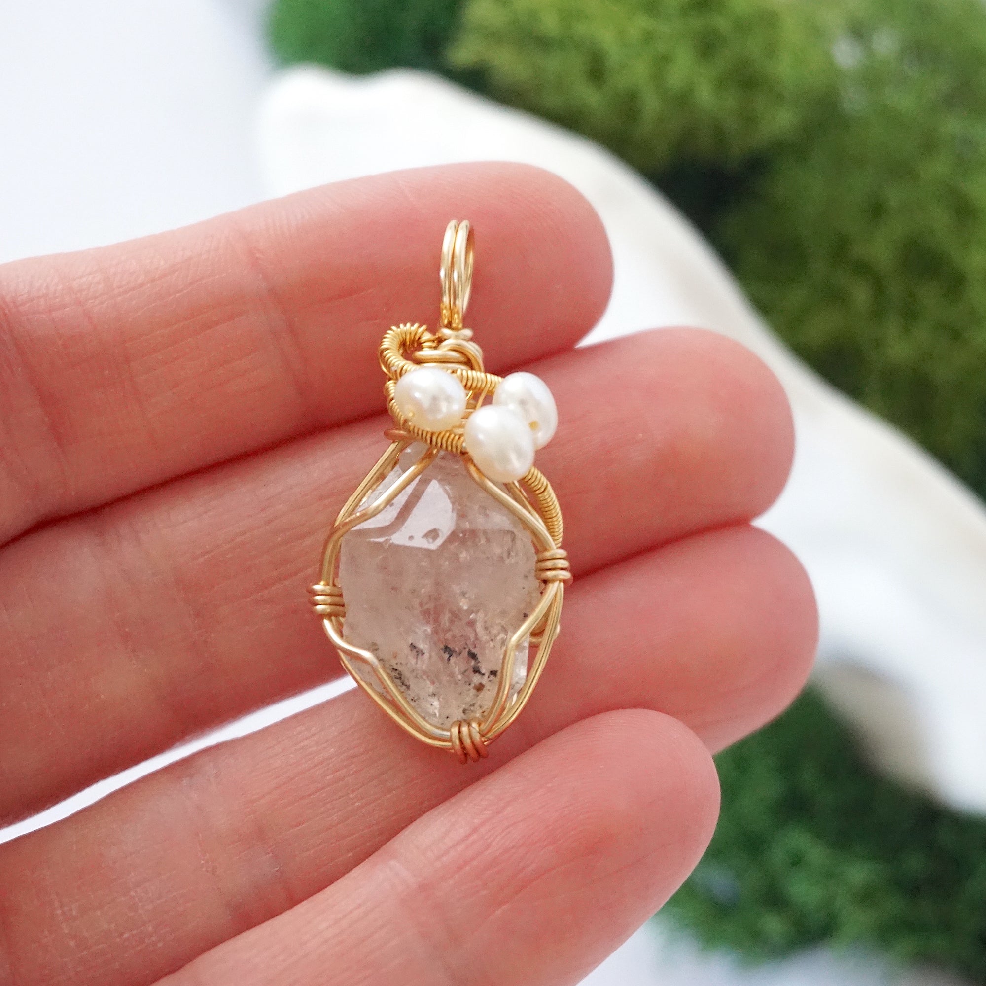 Herkimer diamond and freshwater pearl necklace pendant in hand for size reference, artisan birthstone jewelry gift for her