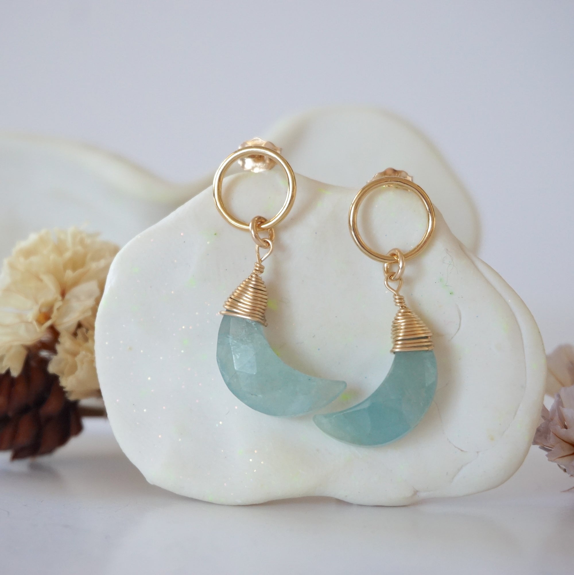 Detailed close-up of Lux Limited Edition Aquamarine Moon Open Circle Stud Earrings on jewelry display, faceted natural aquamarine, 14k gold filled, handmade.