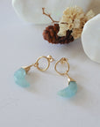 Aquamarine Moon Open Circle Stud Earrings laying flat, 14k gold filled minimalist wire wrap, natural faceted aquamarine, limited edition.