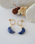 Lapis Lazuli Moon Open Circle Stud Earrings laying flat, 14k gold filled minimalist wire wrap, natural faceted lapis lazuli, limited edition.