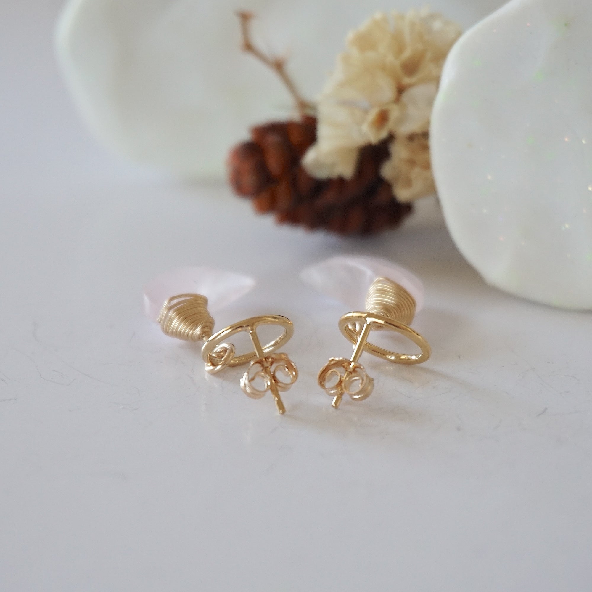 Detailed close-up of open circle stud earring closure, Lux Rose Quartz Moon Stud Earrings, 14k gold filled, handmade craftsmanship.