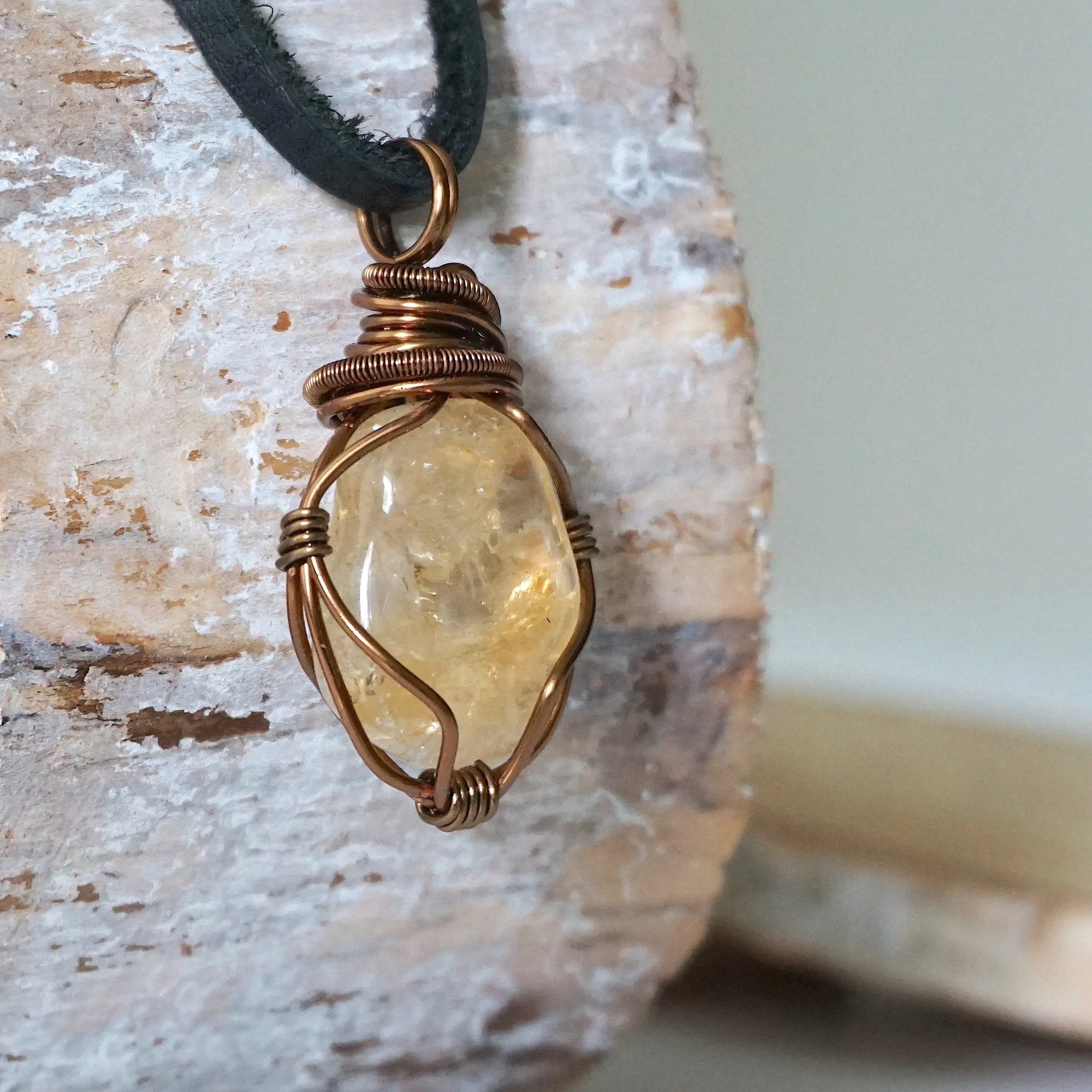 Side angle of mens citrine pendant showing crystal dimension and wire wrapping - natural stone in antique bronze copper handmade masculine necklace profile view
