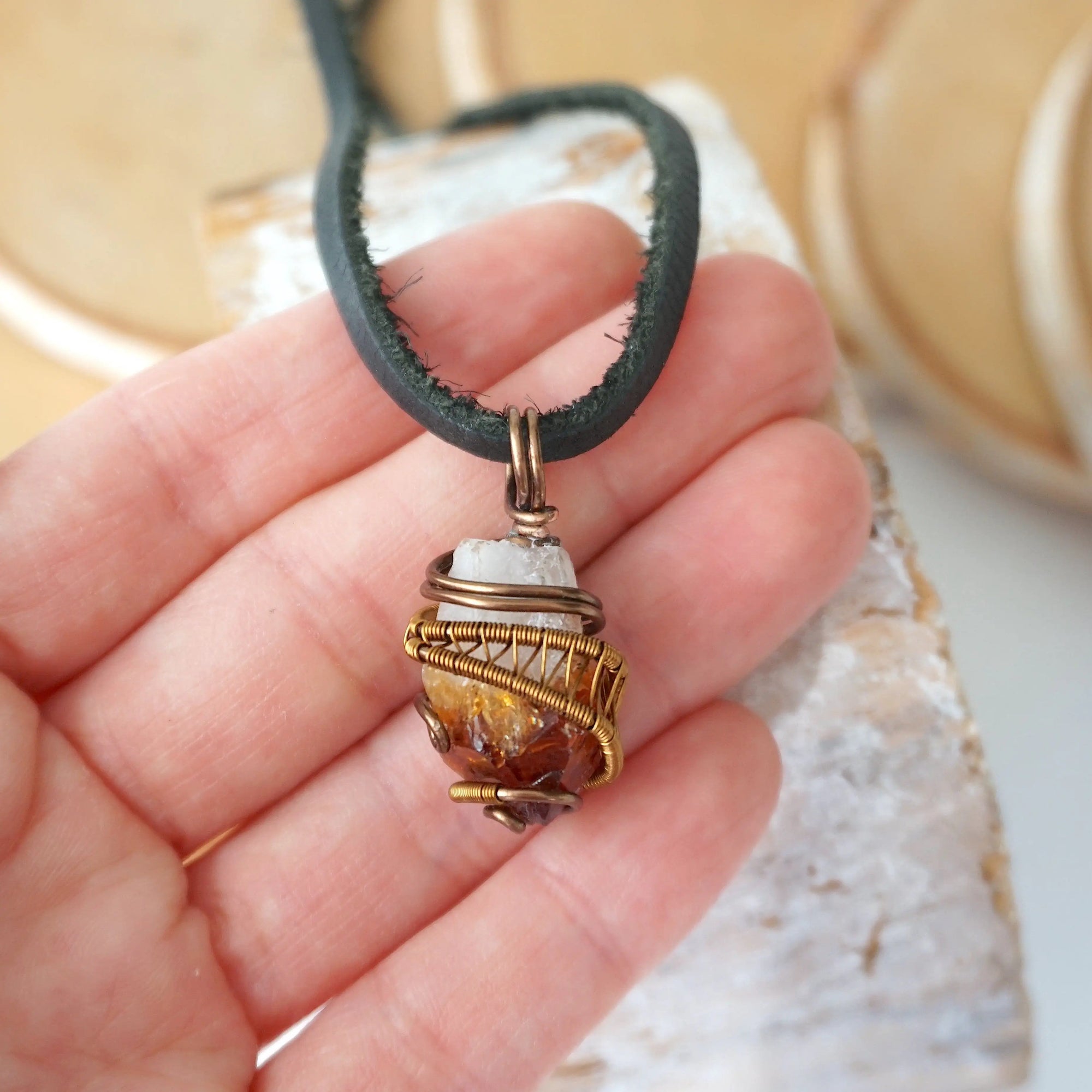 Mens raw citrine pendant held in hand showing size scale - natural unpolished crystal wire wrapped in antique bronze copper masculine necklace size reference