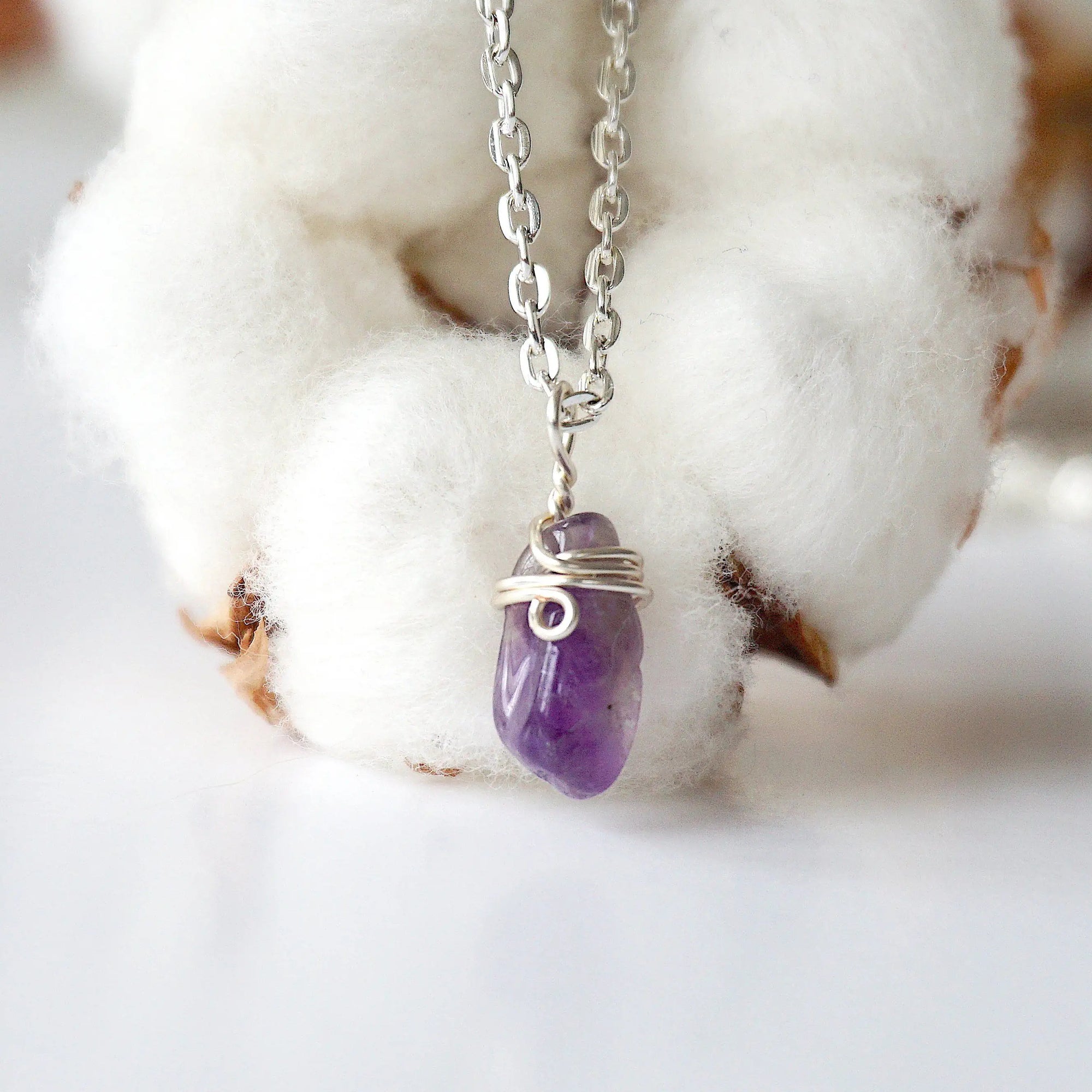 Back side angle of minimalist amethyst necklace, silver plated copper wire wrapped raw amethyst pendant