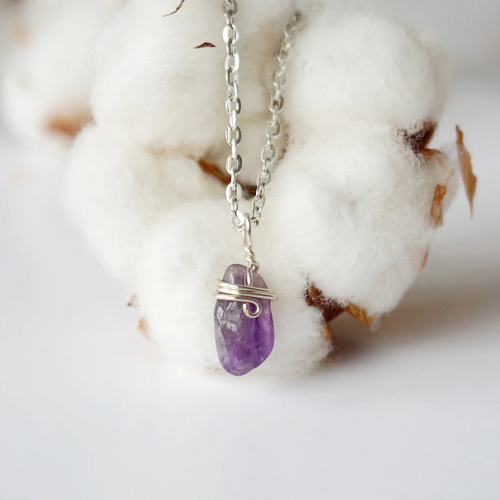 Detailed front view of minimalist amethyst necklace for women, raw amethyst pendant wire wrapped in silver plated copper