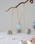 Minimalist aquamarine necklace in gold, detailed front view, genuine gemstone in 14k gold vermeil claw setting, Designs by Nature Gems