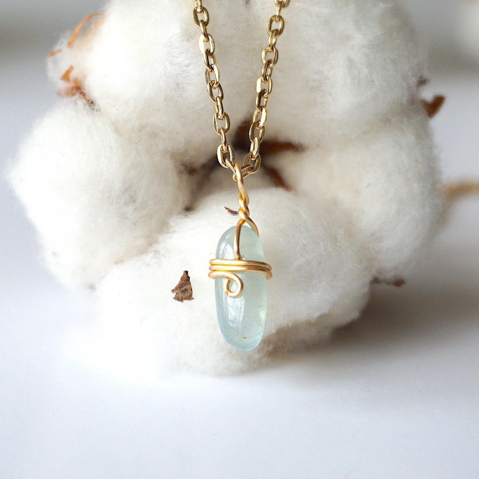 Minimalist aquamarine necklace, detailed front view, genuine polished aquamarine wrapped in warm gold finish over copper wire, March birthstone, Designs by Nature Gems
