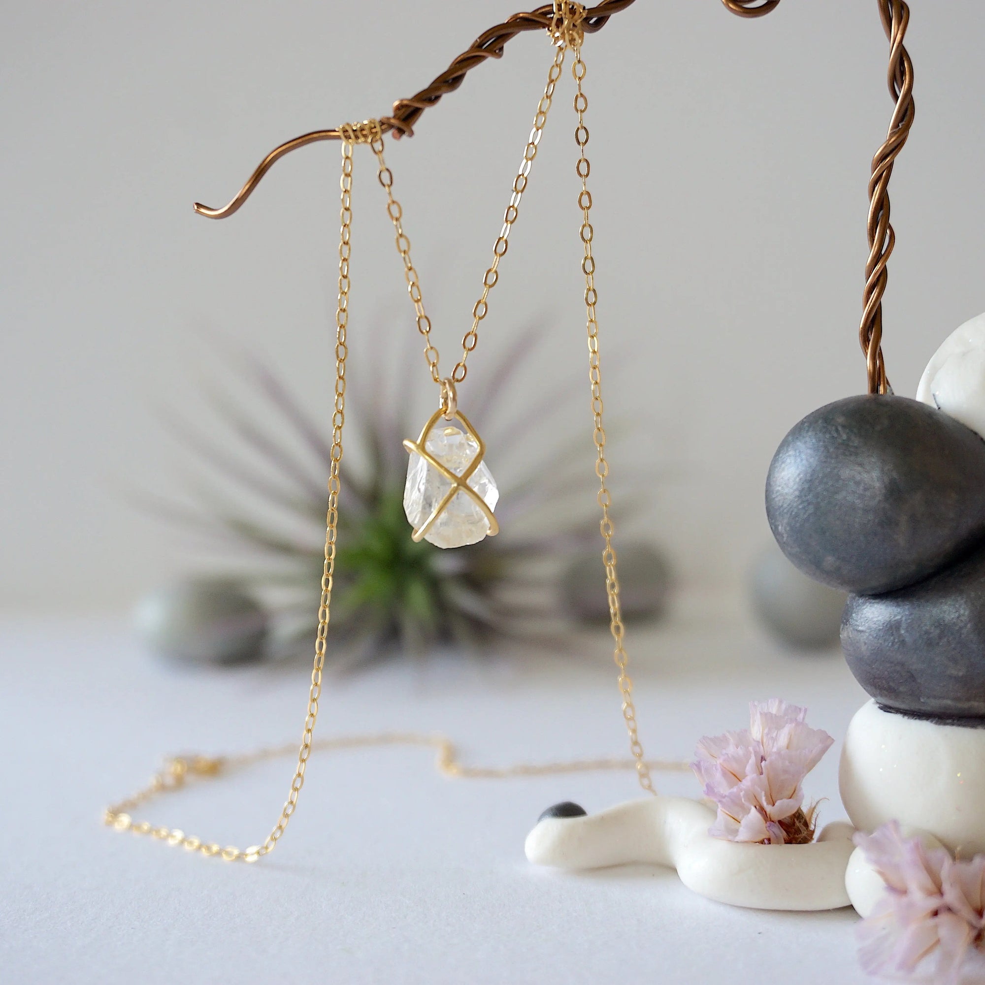 Back angle view of raw Herkimer diamond necklace with minimalist gold vermeil prong setting.