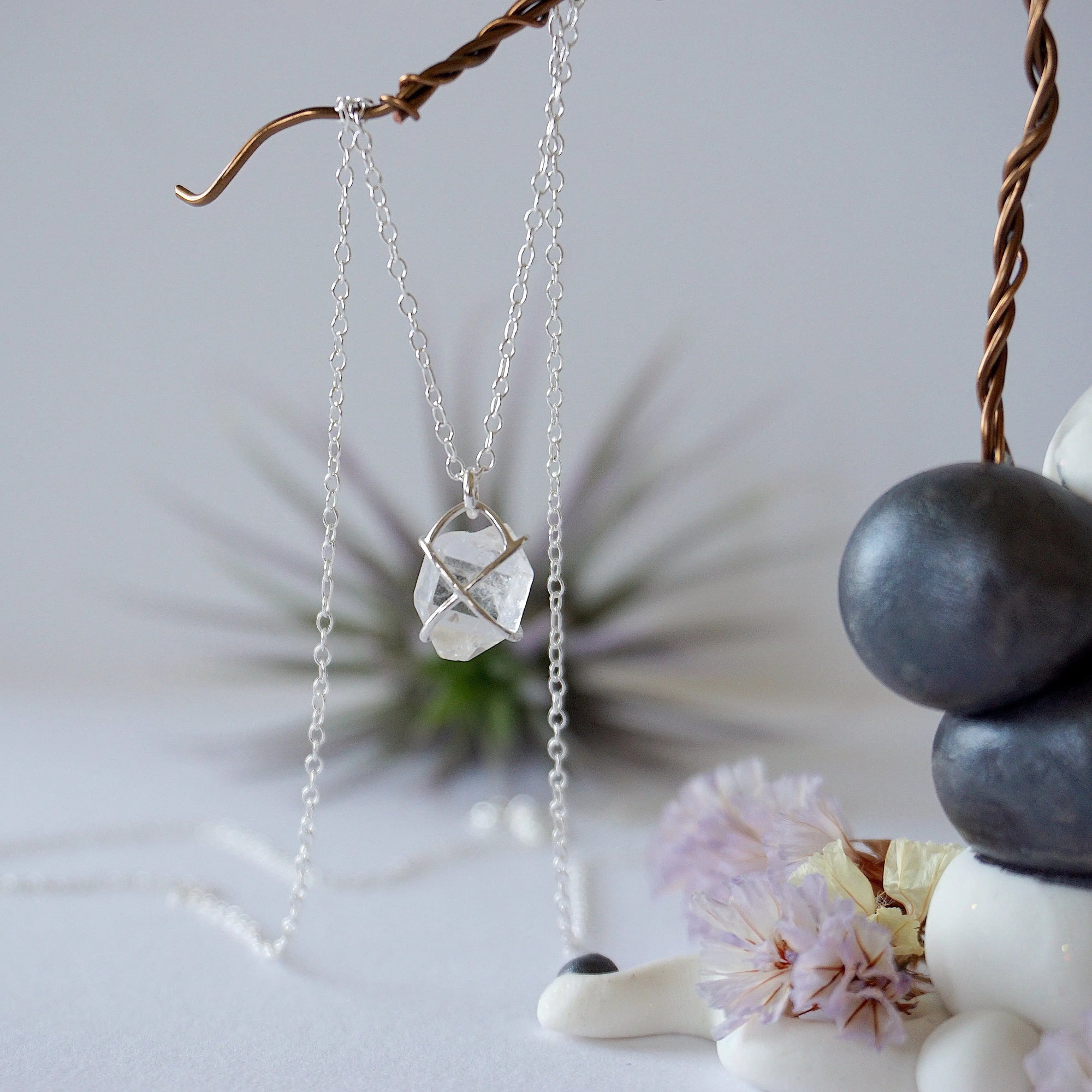 Back angle view of raw Herkimer diamond necklace with minimalist 925 sterling silver prong setting.