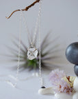 Back angle view of raw Herkimer diamond necklace with minimalist 925 sterling silver prong setting.