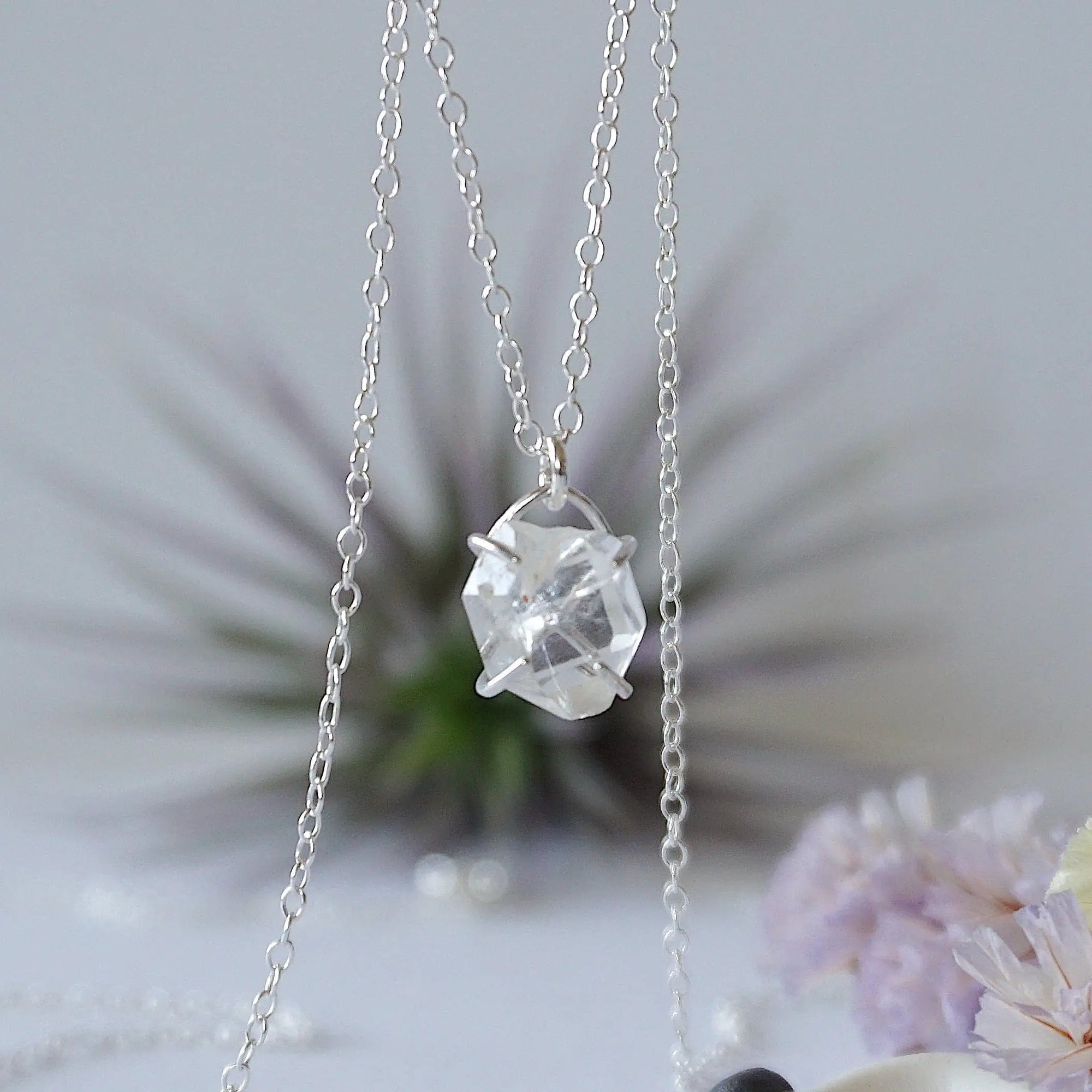 Detailed front view of minimalist Herkimer diamond necklace in 925 sterling silver with natural raw crystal pendant.
