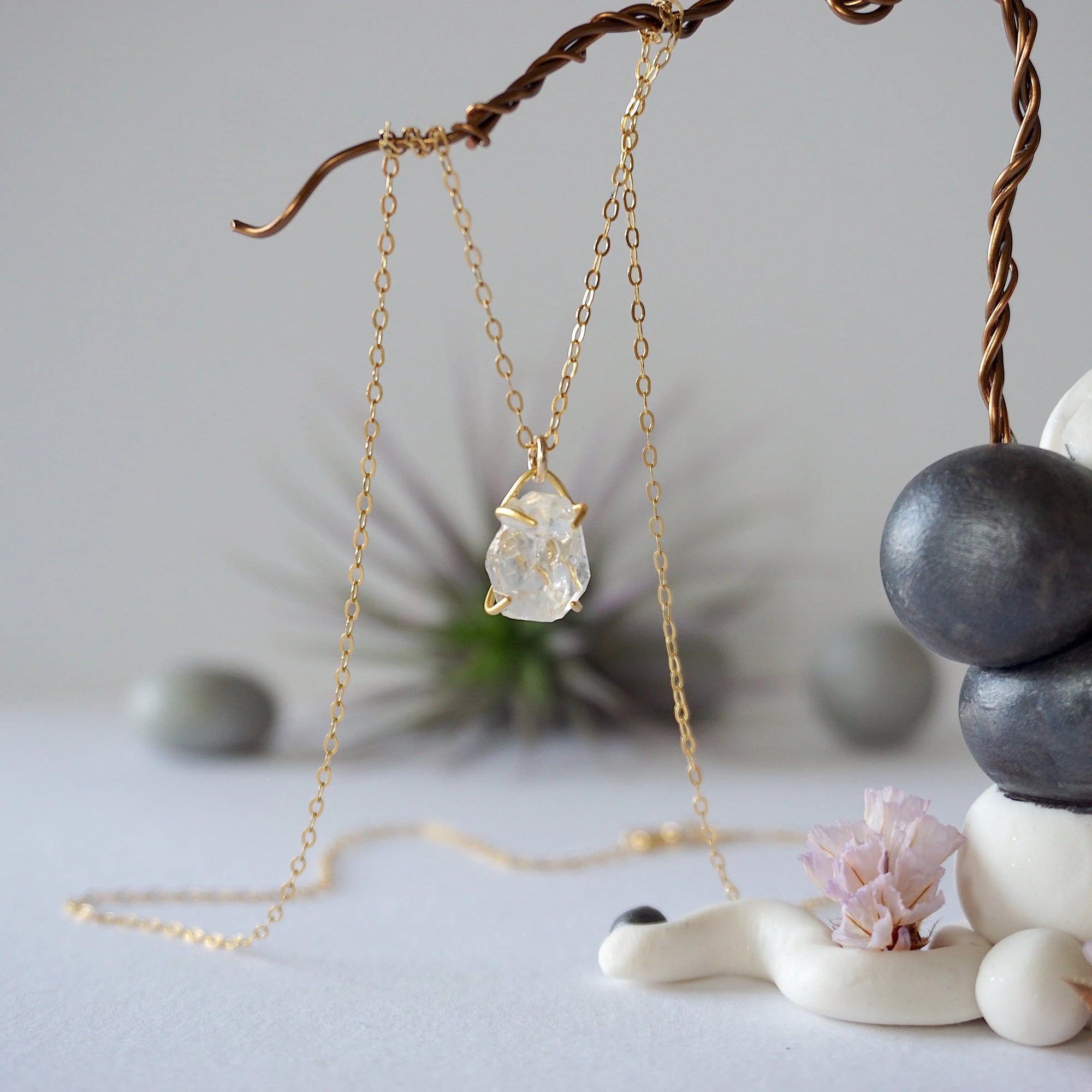 Detailed front view of minimalist Herkimer diamond necklace in gold vermeil with natural raw crystal pendant.