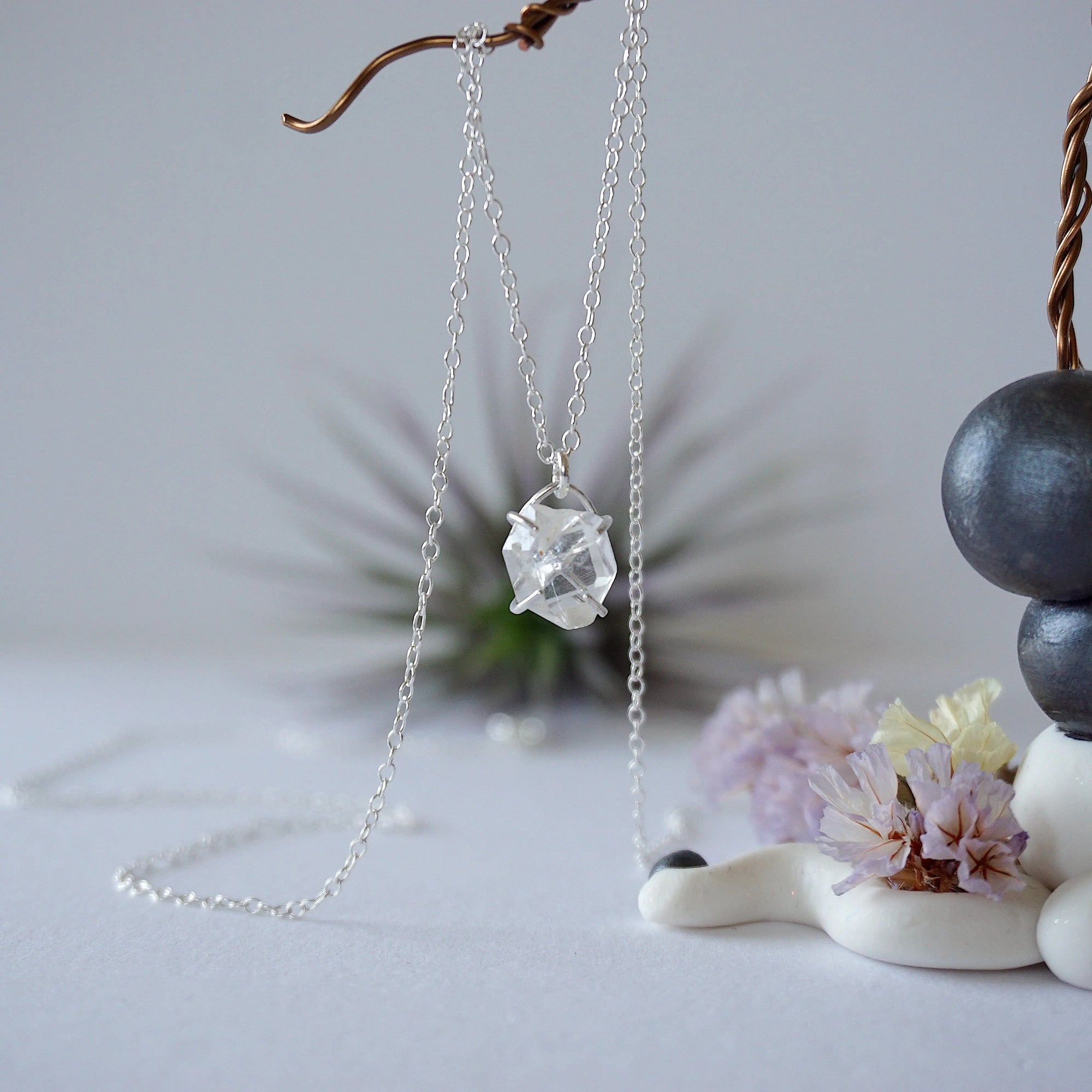 Zoomed out front view of minimalist raw Herkimer diamond necklace in 925 sterling silver for women.