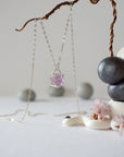 Side angle detail of minimalist raw amethyst necklace in sterling silver, natural unpolished amethyst stone pendant
