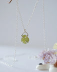 Minimalist raw peridot necklace for women — olive green crystal in four-prong 925 sterling silver setting on fine cable chain, dainty August birthstone jewelry by Designs by Nature Gems