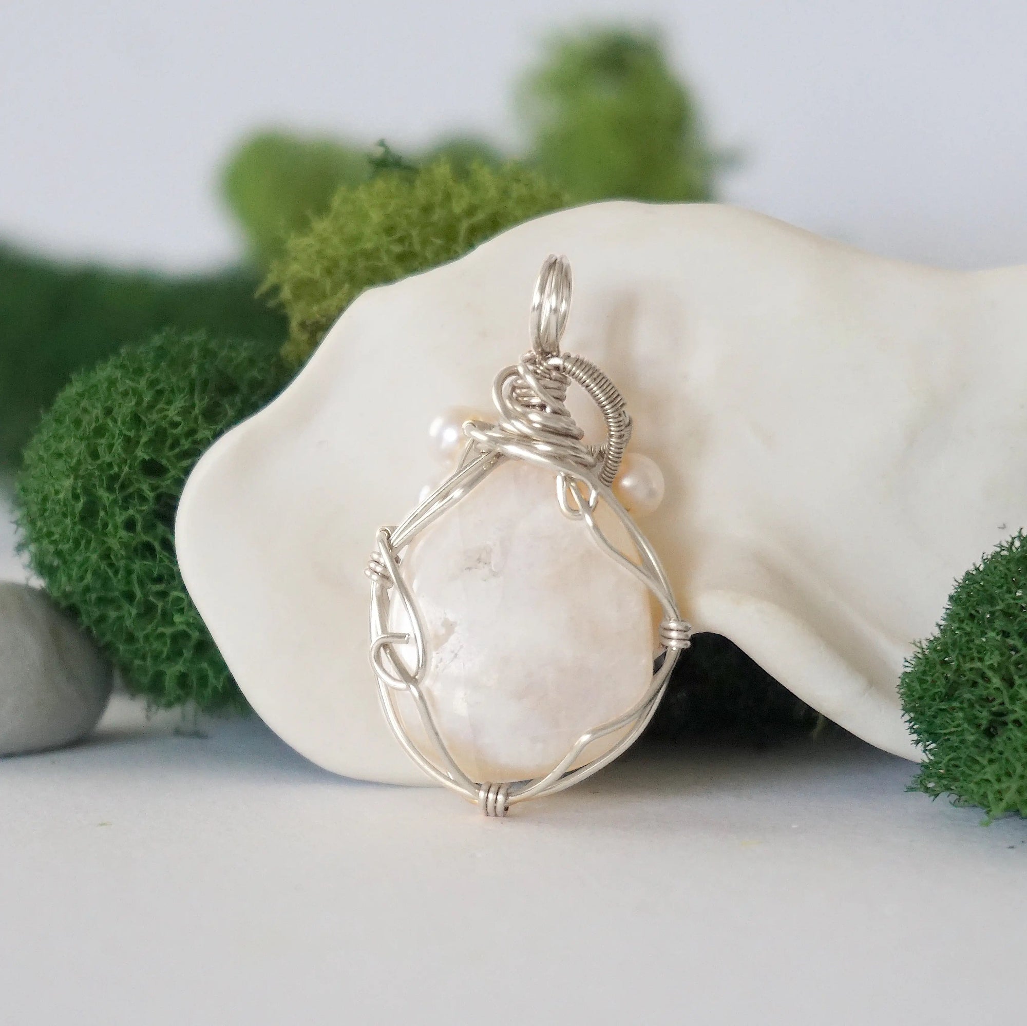 Back detail of silver wire wrapped moonstone and freshwater pearl pendant necklace, handcrafted gemstone jewelry