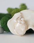Detailed front view of silver wire wrapped moonstone and freshwater pearl pendant, unique artisan necklace