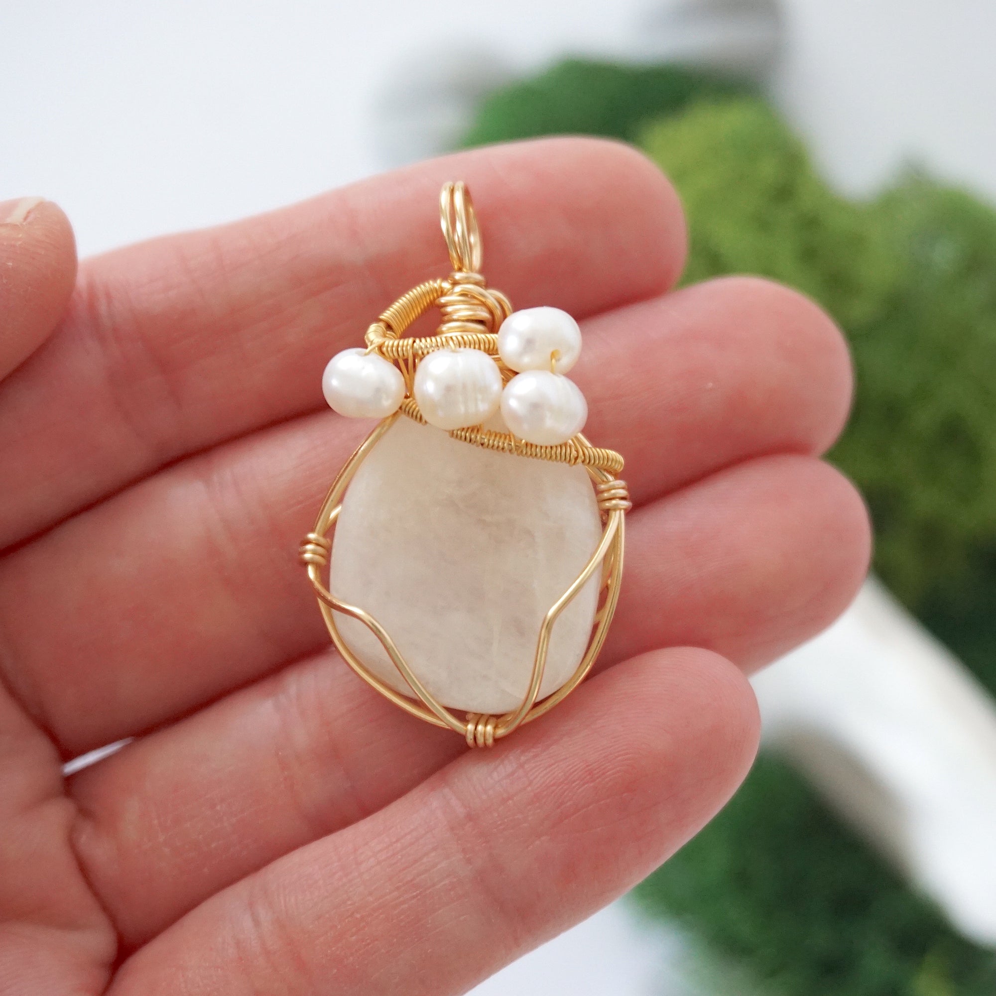 Moonstone and freshwater pearl necklace pendant in hand for size reference, artisan birthstone jewelry gift for her