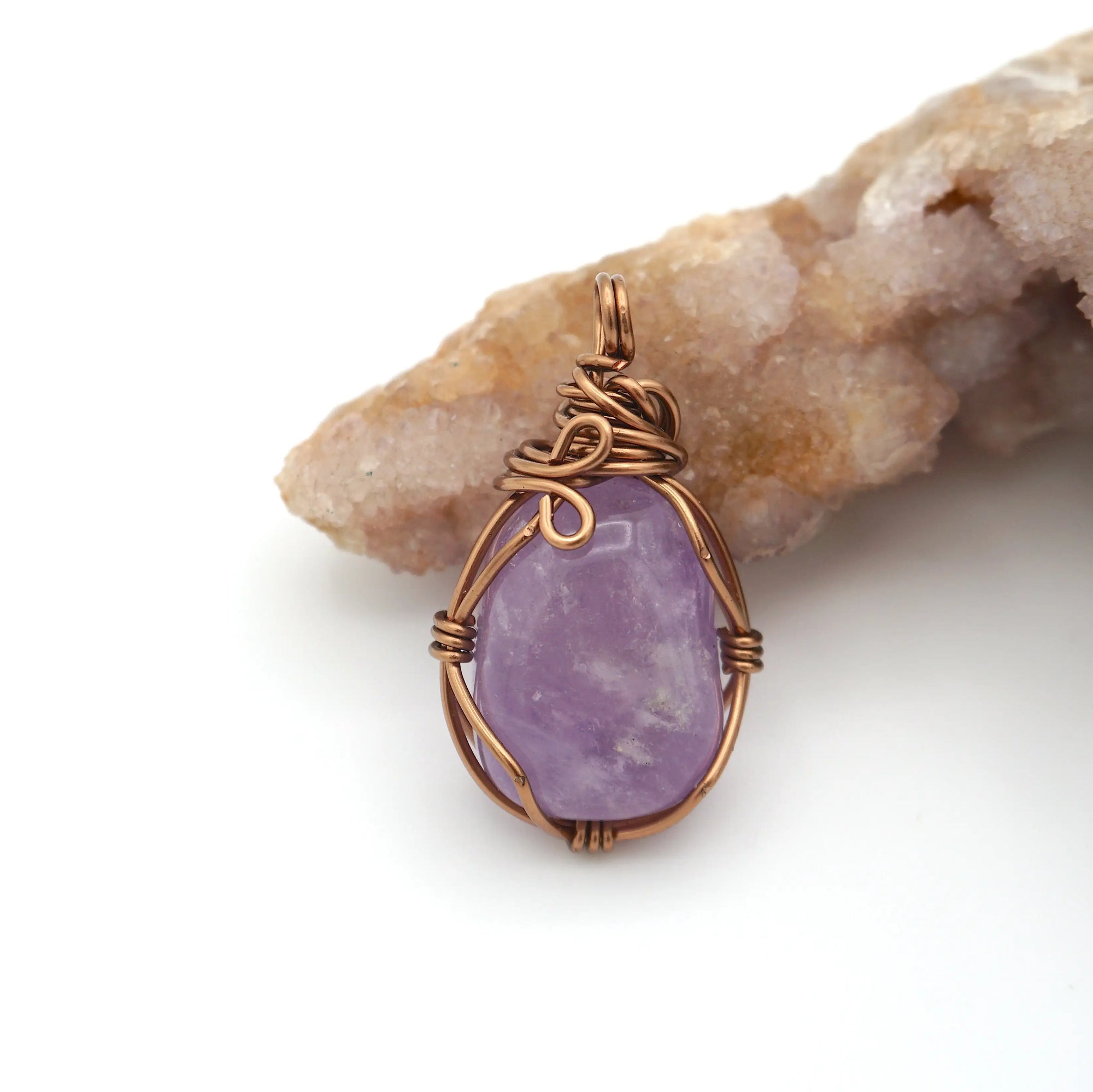 Back view detail of natural amethyst pendant necklace with simple antique bronze copper wire wrap