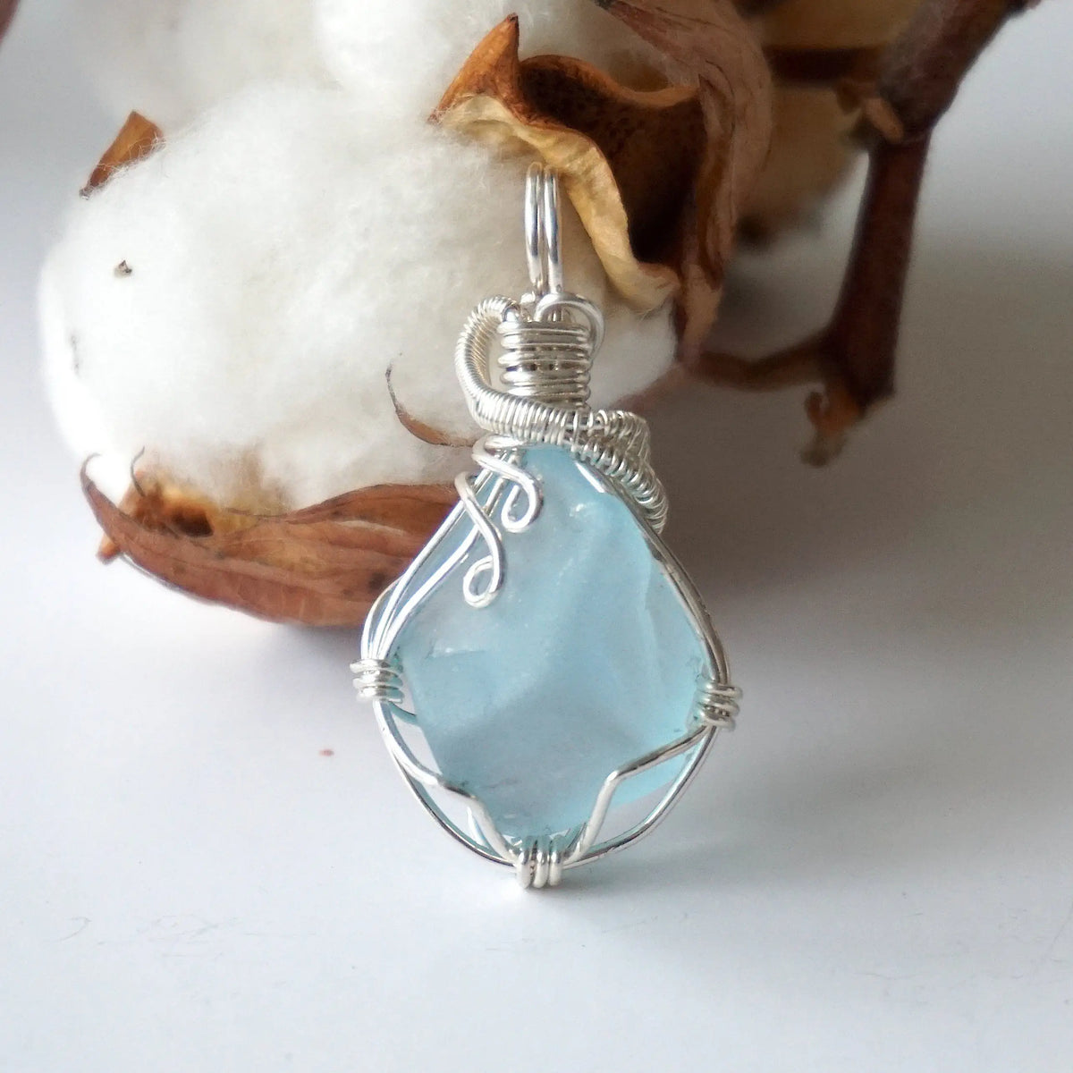 Natural blue topaz pendant hand wire-wrapped in 925 sterling silver