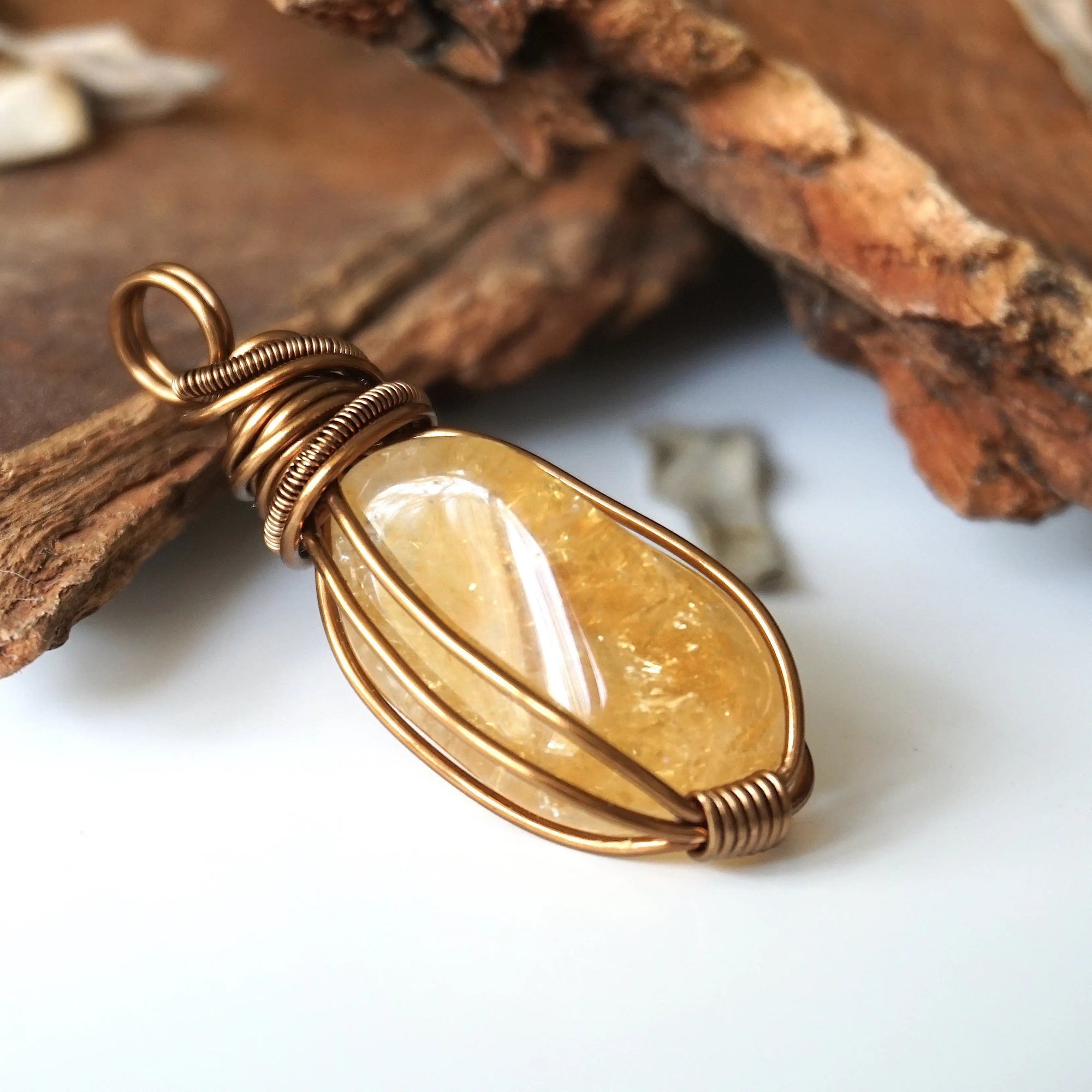 Side angle of natural citrine pendant showing crystal dimension and wire wrap detail - antique bronze copper handmade unisex necklace for women men profile view
