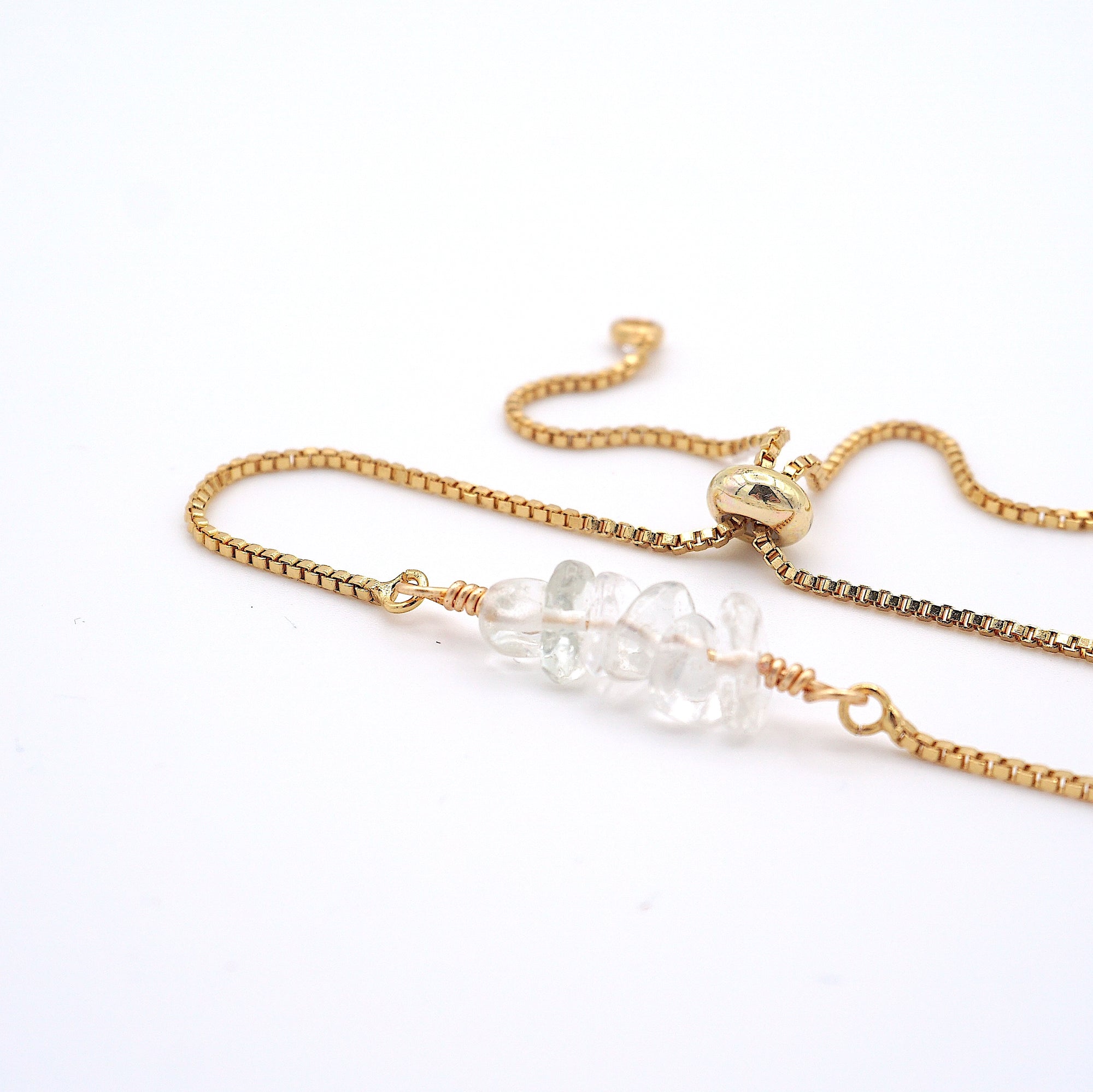 Natural clear quartz slider bracelet with raw crystal quartz stones on gold plated brass adjustable chain - April alternative birthstone jewelry for women
