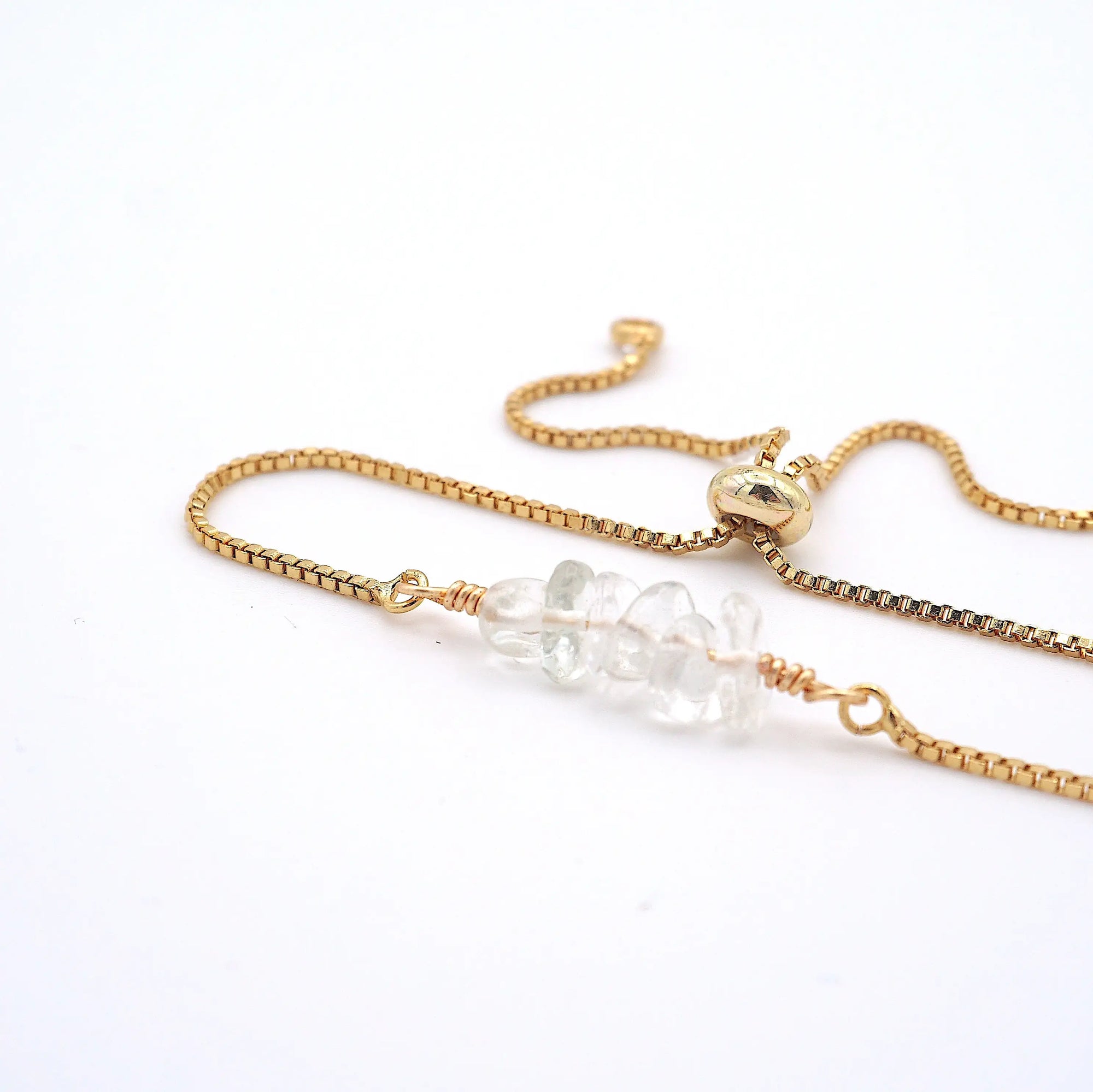Natural clear quartz slider bracelet with raw crystal quartz stones on gold plated brass adjustable chain - April alternative birthstone jewelry for women