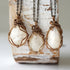 Three natural moonstone necklaces showing natural variation in pendant size, shape, and creamy moonstone color (June birthstone).