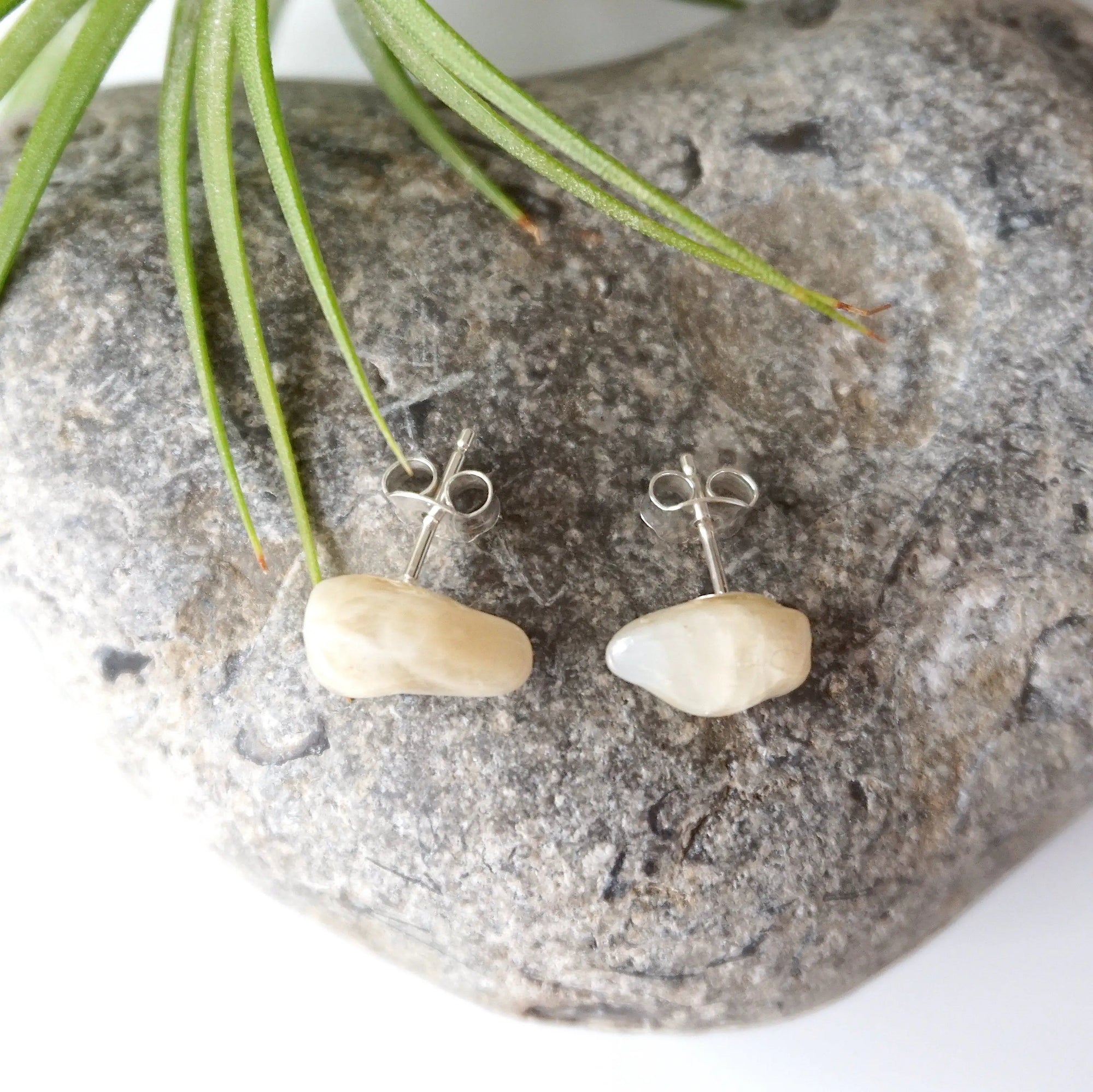 Back view of natural moonstone stud earrings showing 925 sterling silver posts and backs, minimalist June birthstone earrings.