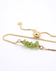Natural peridot slider bracelet with raw green crystals on gold plated chain, handmade August birthstone jewelry