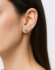 Woman wearing natural turquoise stud earrings - December birthstone sterling silver studs for everyday wear