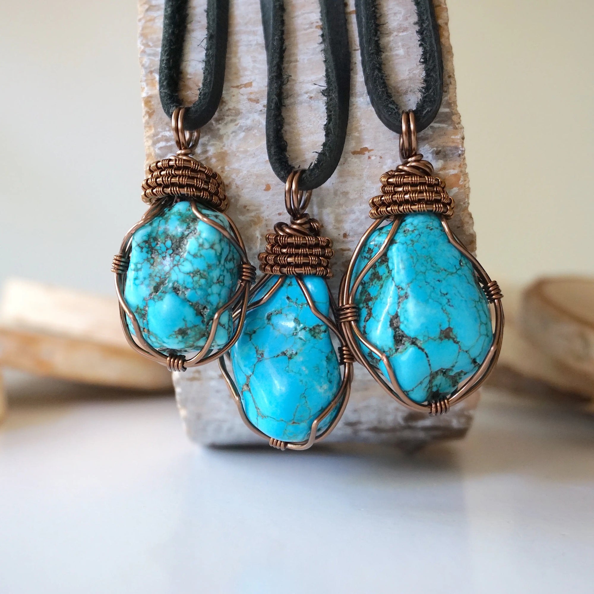 Natural turquoise necklace men showing 3 unique stone variations on leather