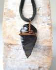 Back view of black obsidian arrowhead pendant with antique bronze copper wire wrap, handcrafted men’s necklace by Designs by Nature Gems.