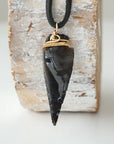 Back view of black obsidian arrowhead pendant with gold plated copper wire wrap, handcrafted men’s necklace by Designs by Nature Gems.