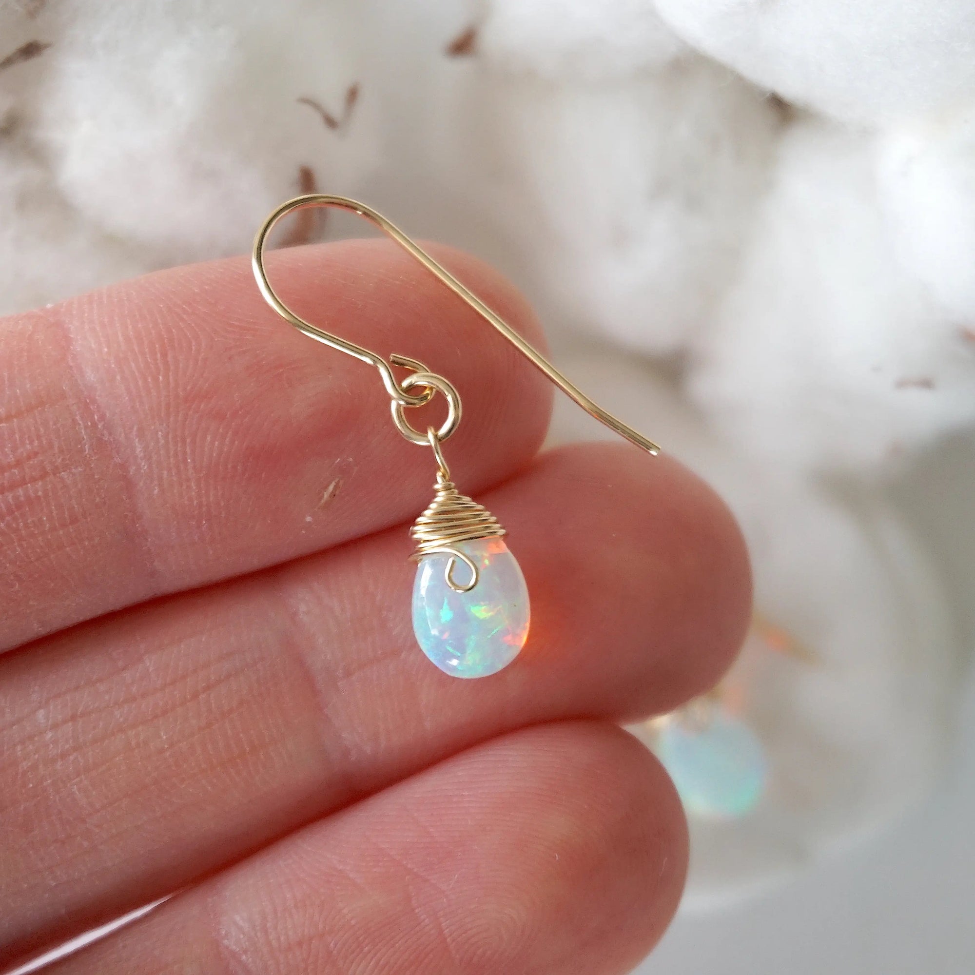 Opal drop earrings in hand for size reference, natural faceted opal, 14k gold filled